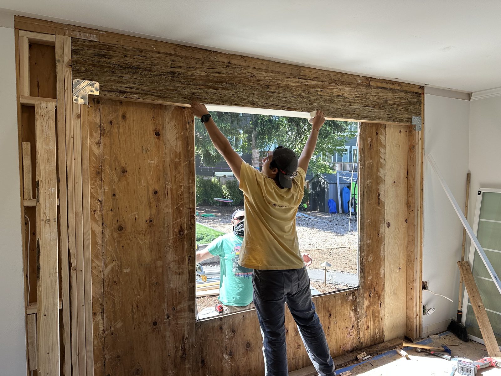 Interior stripped back to studs during a door replacement in Issaquah