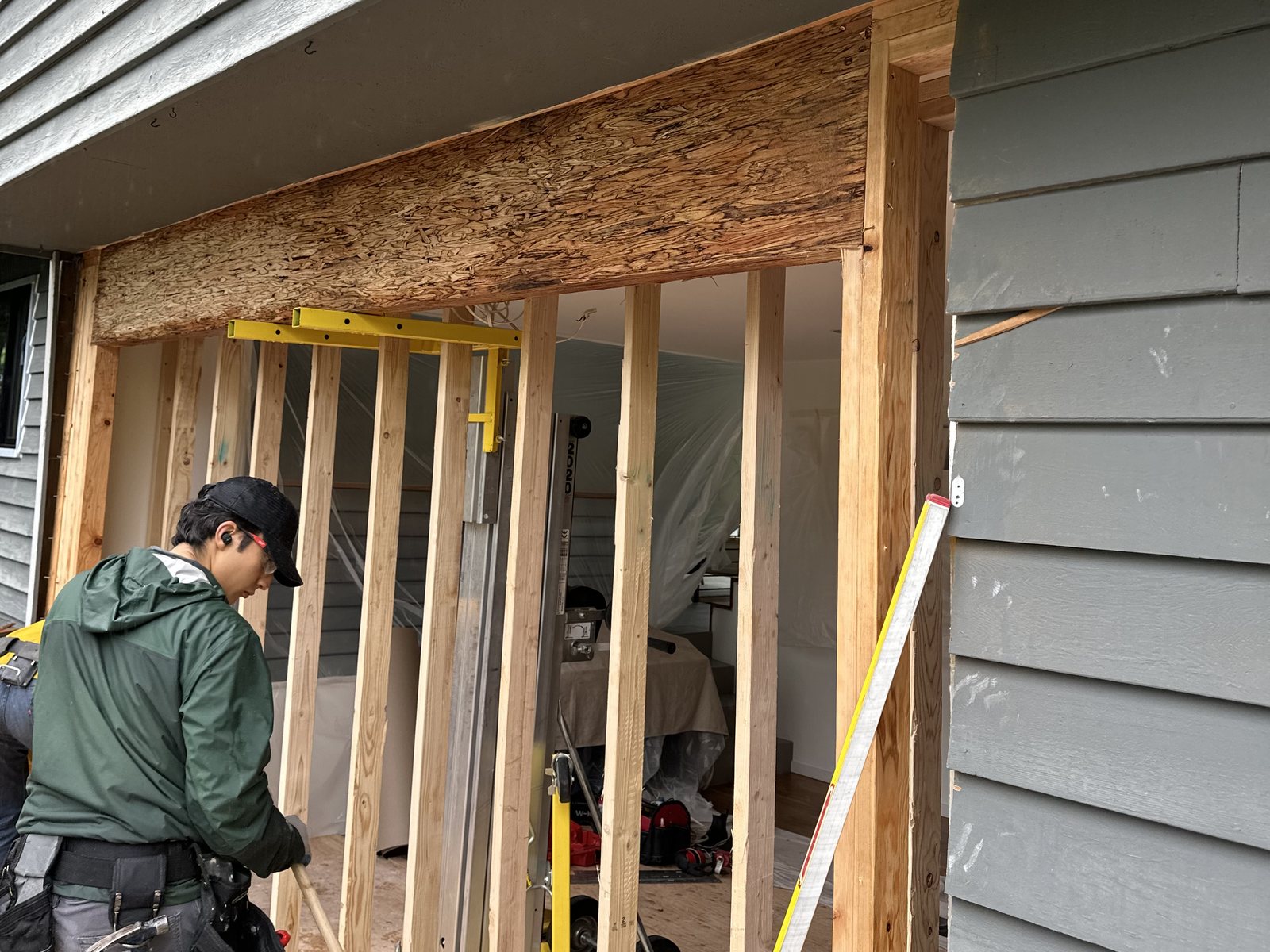 Window Fellas installer framing a new window opening in an exterior wall