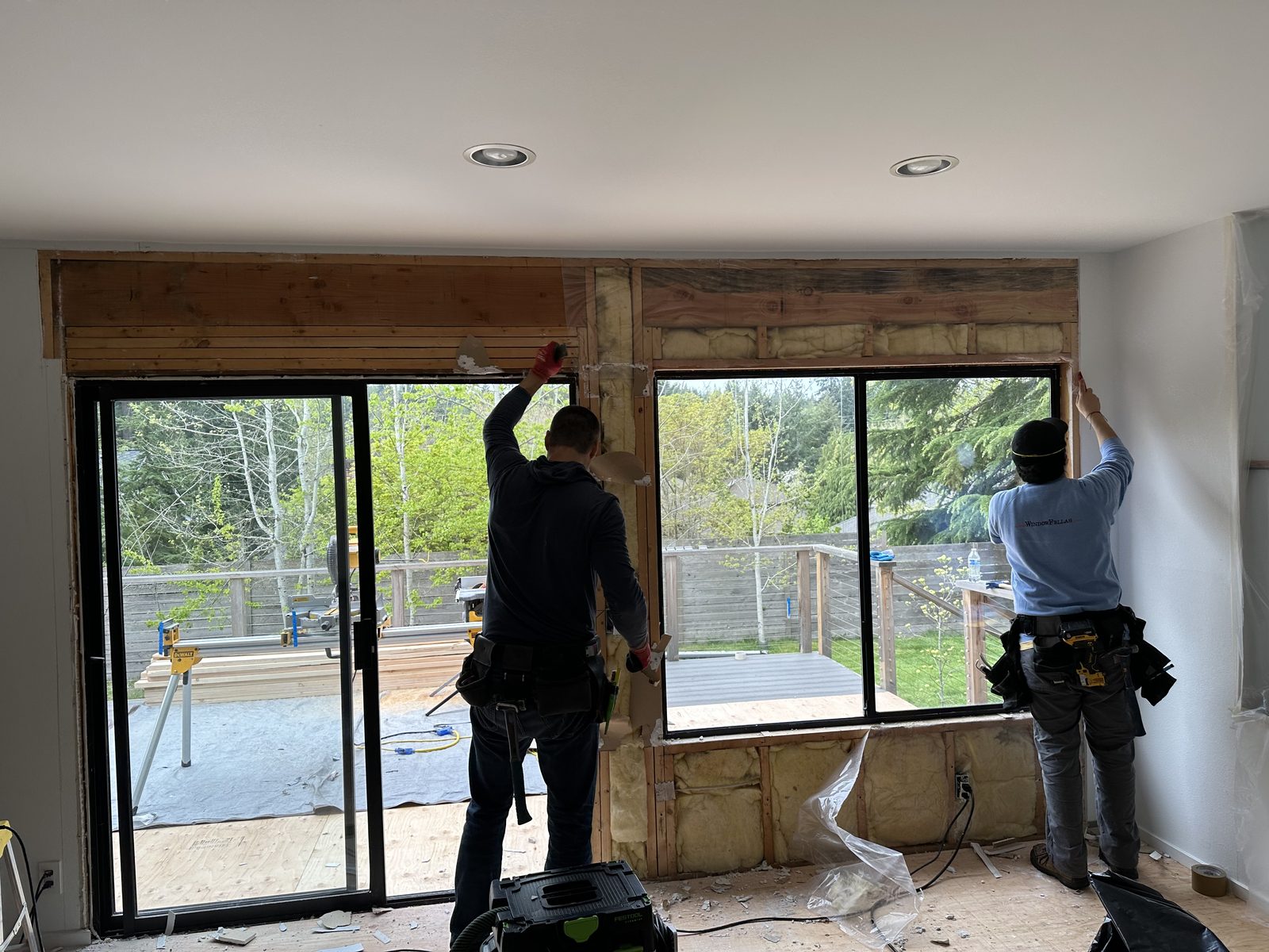 Window Fellas installers fitting a large sliding patio door in Sammamish