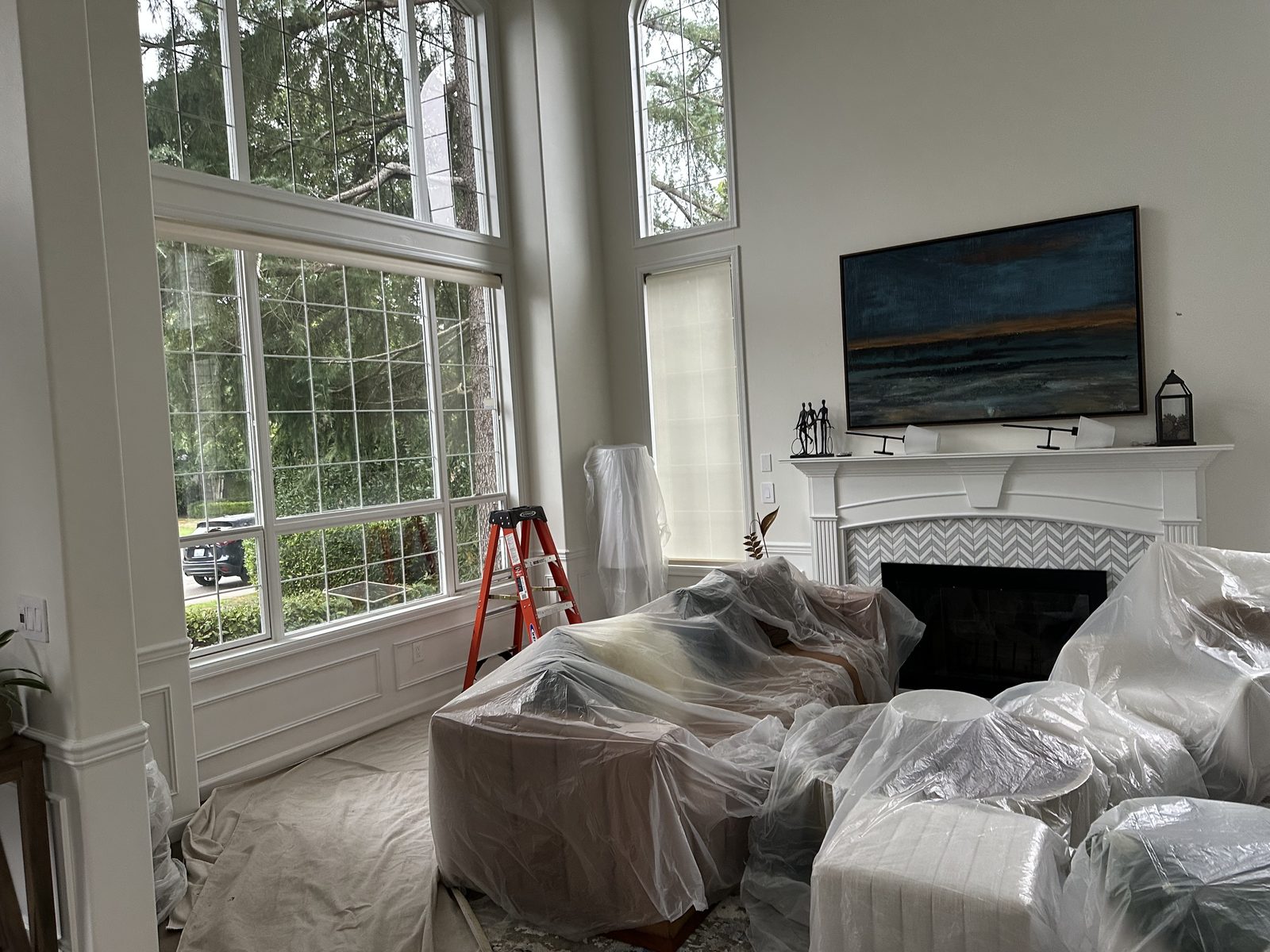 Sammamish living room with tall windows, furniture protected during window replacement