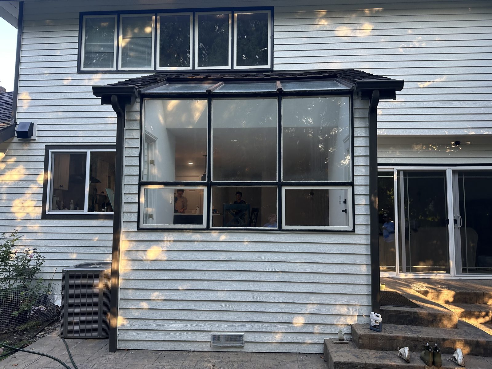 Redmond skywall before replacement — dated bronze frames divided into small panes