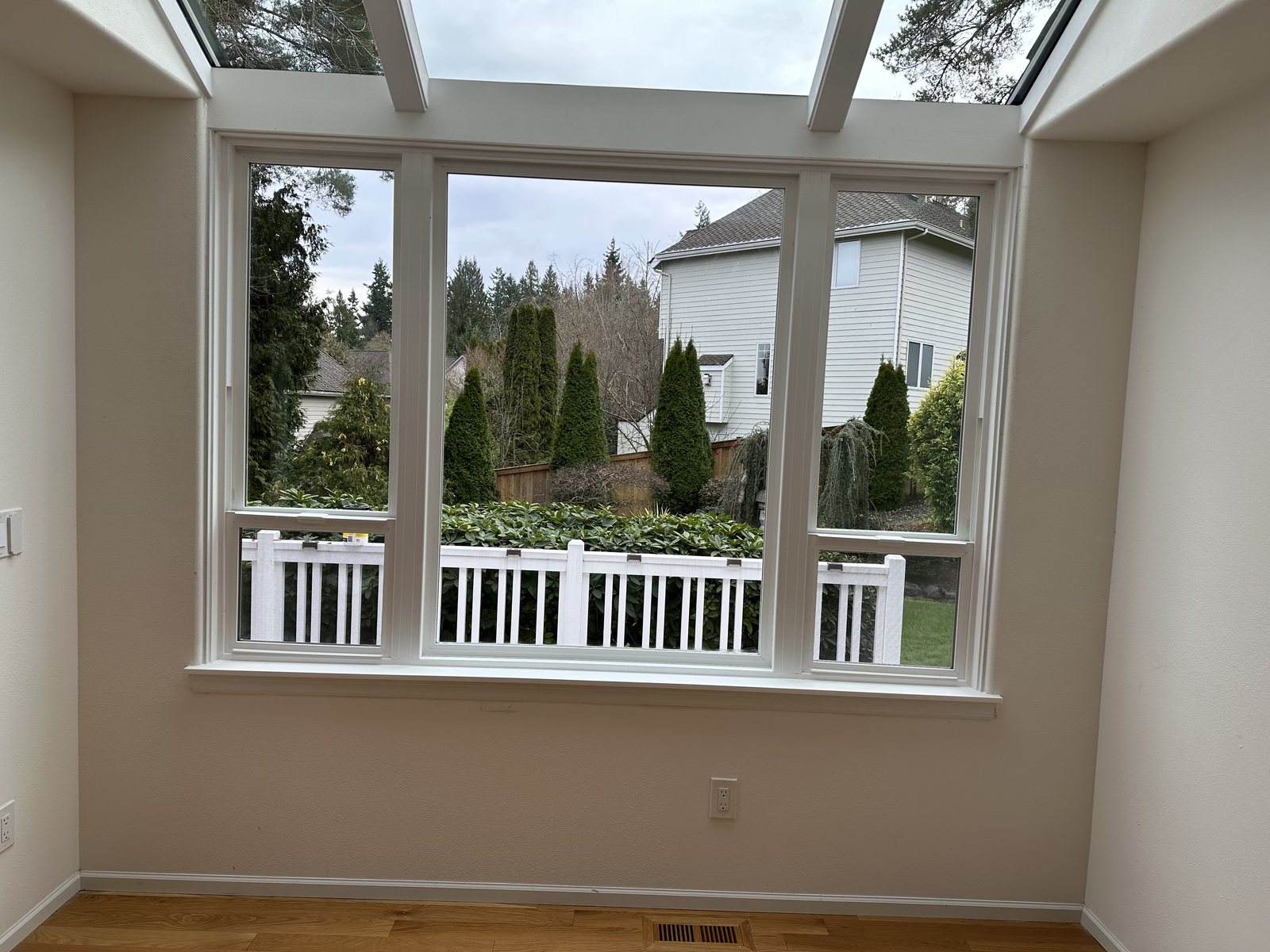 Skywall interior after replacement, white frames under a sloped glass roof