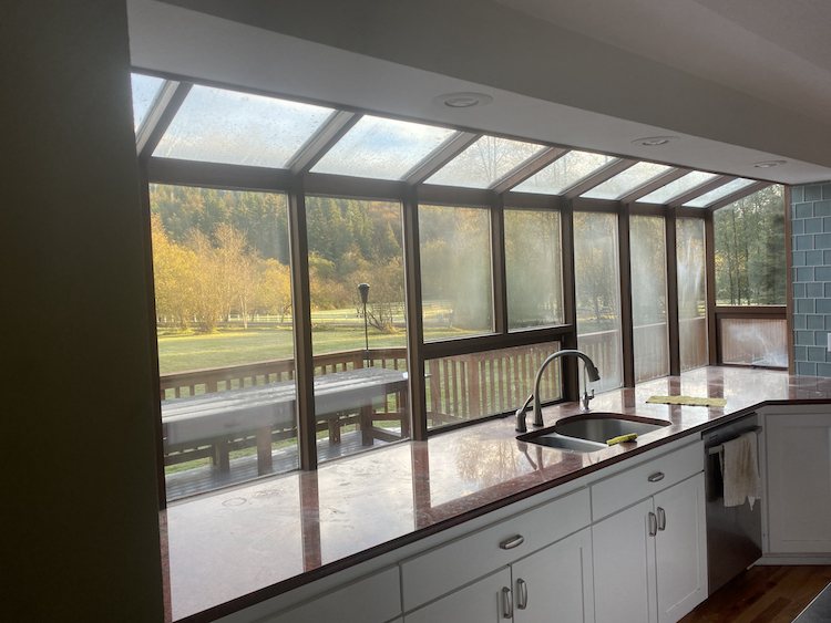 Skywall glass roof over a kitchen with a valley view