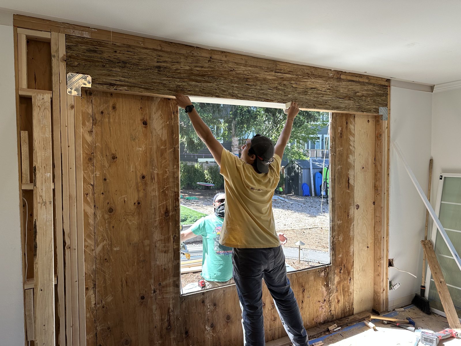 Window Fellas crew opening an interior wall for new windows